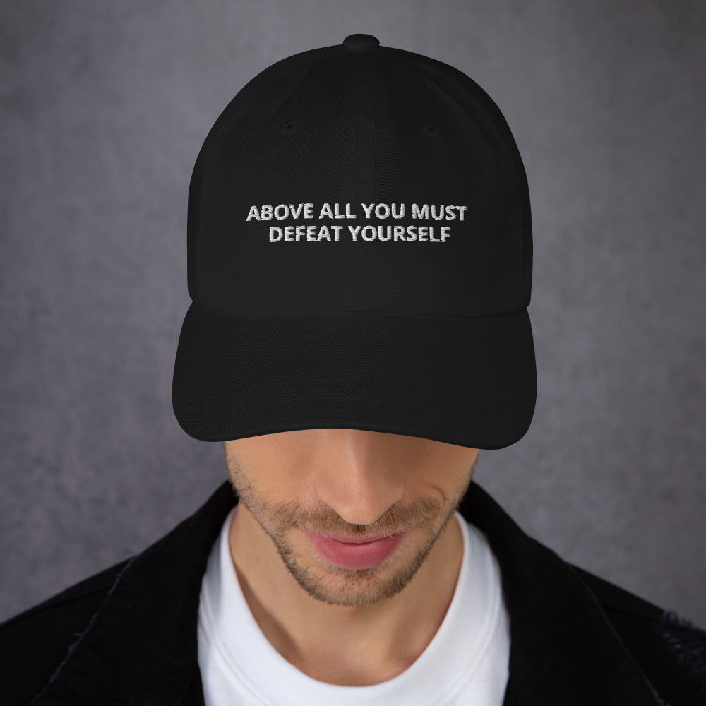 ABOVE ALL YOU MUST DEFEAT YOURSELF hat