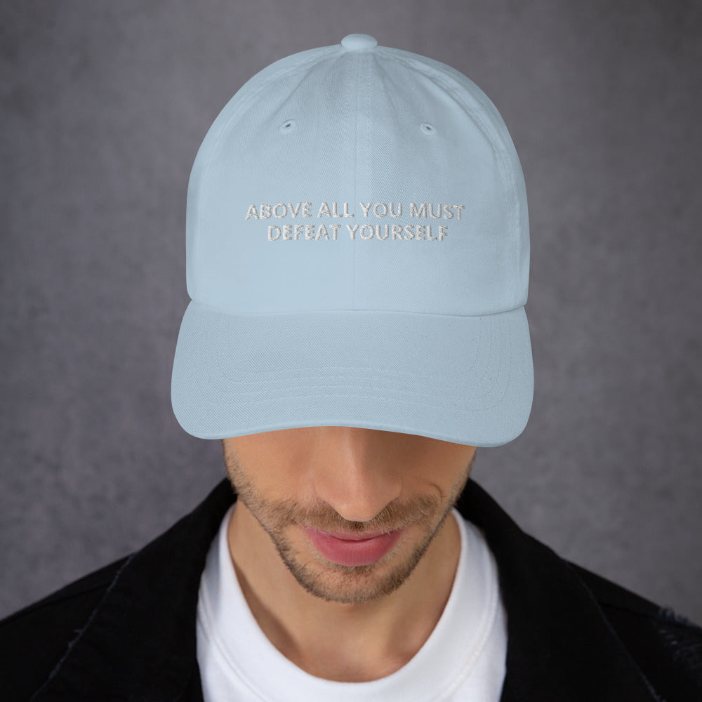 ABOVE ALL YOU MUST DEFEAT YOURSELF hat