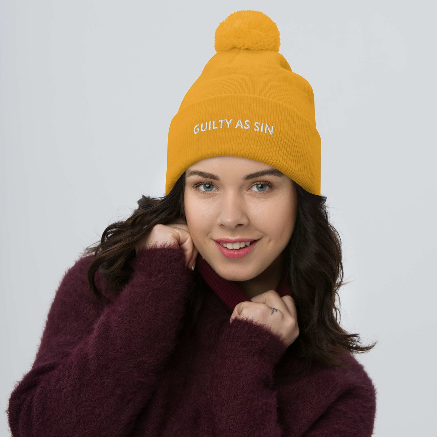 GUILTY AS SIN Pom-Pom Beanie