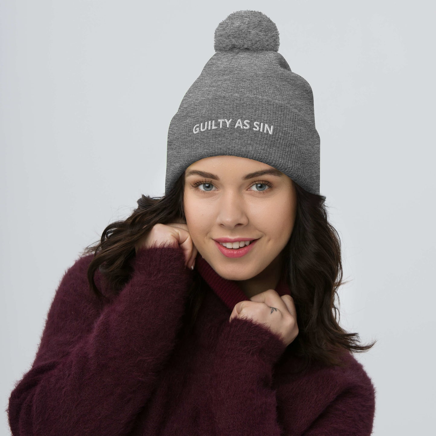 GUILTY AS SIN Pom-Pom Beanie